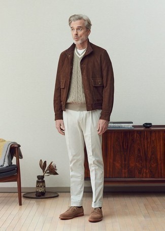Men's Outfits 2024: Why not consider teaming a dark brown suede bomber jacket with white chinos? As well as super practical, these pieces look cool when paired together. Brown suede derby shoes will bring a dose of elegance to an otherwise straightforward look.