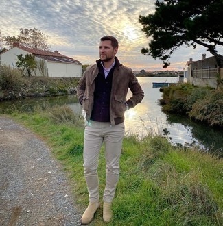 Dark Brown Suede Bomber Jacket Outfits For Men: For an outfit that brings comfort and dapperness, try teaming a dark brown suede bomber jacket with beige chinos. For a smarter twist, why not introduce beige suede chelsea boots to the equation?