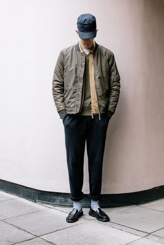 Navy Chinos Outfits: Consider wearing an olive bomber jacket and navy chinos for both dapper and easy-to-wear ensemble. Black leather loafers are a fail-safe way to breathe a dash of elegance into this look.