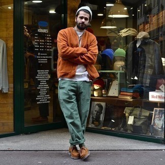 Orange Fleece Bomber Jacket Outfits For Men: This combo of an orange fleece bomber jacket and dark green chinos is on the off-duty side but is also stylish and incredibly dapper. A pair of brown suede desert boots is a smart choice to finish this getup.