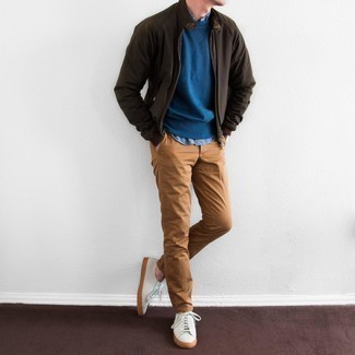 Dark Brown Bomber Jacket Outfits For Men: Pair a dark brown bomber jacket with tobacco chinos for a casual kind of refinement. Our favorite of an infinite number of ways to round off this ensemble is with a pair of white canvas low top sneakers.