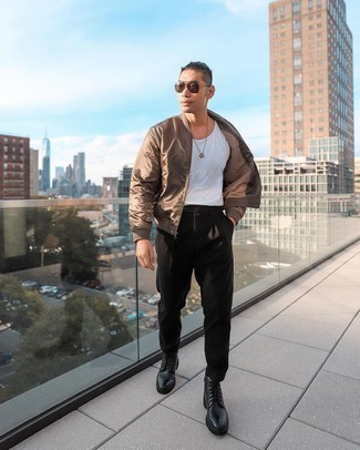 Dark Brown Satin Bomber Jacket Outfits For Men: Why not wear a dark brown satin bomber jacket with black chinos? As well as super comfortable, both pieces look amazing when married together. For a more polished finish, complement this getup with a pair of black leather casual boots.