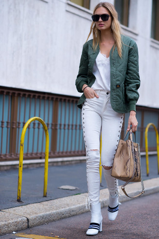 White Skinny Jeans Outfits: A dark green quilted bomber jacket and white skinny jeans will add serious cool to your off-duty repertoire. To add a bit of zing to your look, add a pair of white leather ankle boots to the mix.