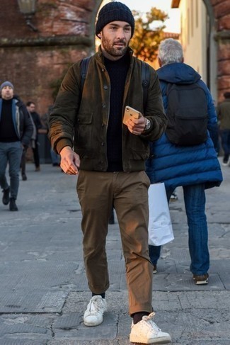 Turtleneck Outfits For Men: For relaxed dressing with a modern take, rock a turtleneck with brown chinos. Want to dial it down when it comes to footwear? Add white studded leather low top sneakers to your ensemble for the day.