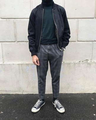 Dark Green Turtleneck Outfits For Men: Consider pairing a dark green turtleneck with grey plaid chinos for a laid-back kind of refinement. Our favorite of a countless number of ways to complete this ensemble is a pair of navy and white canvas low top sneakers.
