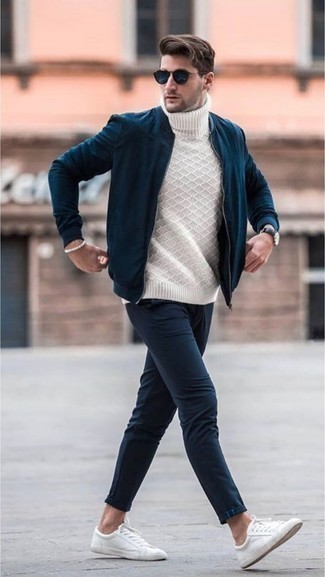 White Knit Wool Turtleneck Outfits For Men: Marry a white knit wool turtleneck with navy chinos for a comfortable look that's also put together nicely. When it comes to footwear, this getup is completed really well with white canvas low top sneakers.