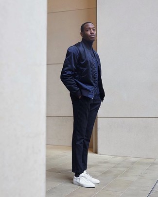 Navy Turtleneck Outfits For Men: For effortless style without the need to sacrifice on functionality, we love this pairing of a navy turtleneck and navy vertical striped chinos. Let your expert styling truly shine by rounding off your ensemble with white canvas low top sneakers.