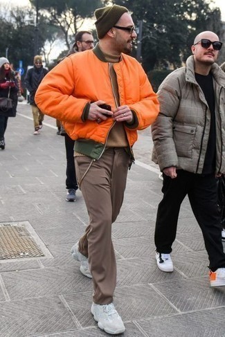 Men's Orange Bomber Jacket, Tan Wool Turtleneck, Brown Chinos, White Athletic Shoes