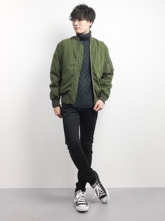 Black and White Canvas Low Top Sneakers Outfits For Men: An olive bomber jacket looks especially nice when combined with black chinos in an off-duty look. Finish off this getup with black and white canvas low top sneakers for a fashionable hi/low mix.