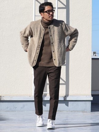 Dark Brown Turtleneck Outfits For Men: A dark brown turtleneck and dark brown chinos are a pairing that every trendsetting man should have in his casual routine. Complete your getup with a pair of white canvas high top sneakers for a fashionable hi/low mix.