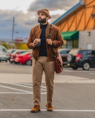 Tan Bucket Hat Outfits For Men: Dress in a brown suede bomber jacket and a tan bucket hat for comfort dressing with an edgy twist. Brown suede desert boots are guaranteed to infuse an air of sophistication into this outfit.