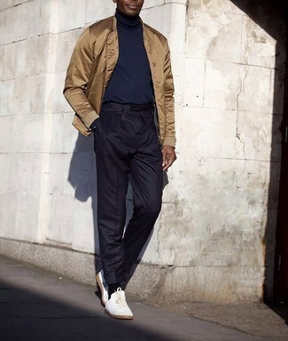 Beige Bomber Jacket Outfits For Men: This is irrefutable proof that a beige bomber jacket and navy dress pants are awesome when teamed together in an elegant ensemble for a modern gentleman. Rounding off with white canvas low top sneakers is a simple way to introduce a laid-back touch to this look.