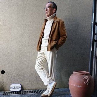 Brown Bomber Jacket Outfits For Men: Pairing a brown bomber jacket and white dress pants is a guaranteed way to infuse your closet with some masculine refinement. Finishing off with a pair of white canvas low top sneakers is an easy way to add a more laid-back aesthetic to your outfit.