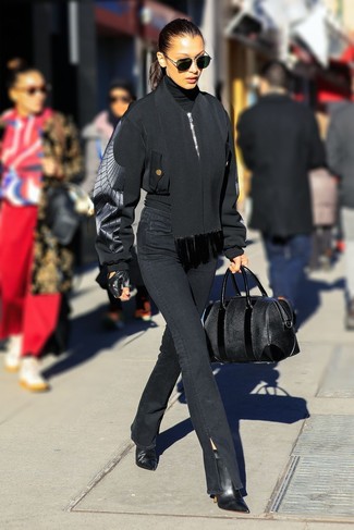 Bella Hadid wearing Black Bomber Jacket, Black Turtleneck, Black Jeans, Black Leather Ankle Boots