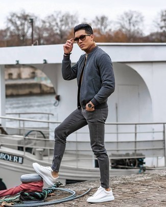 Beige Wool Turtleneck Outfits For Men: Nail the casually stylish look in a beige wool turtleneck and charcoal jeans. This ensemble is completed perfectly with white leather low top sneakers.
