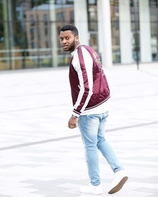 Burgundy Print Bomber Jacket Outfits For Men: This relaxed casual combination of a burgundy print bomber jacket and light blue ripped jeans is a lifesaver when you need to look dapper in a flash. Want to break out of the mold? Then why not add white canvas low top sneakers to the mix?