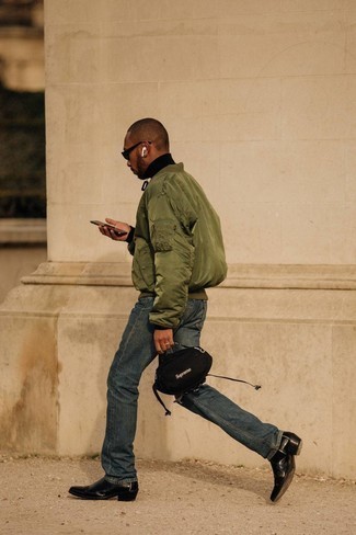 Olive Bomber Jacket Outfits For Men: Wear an olive bomber jacket with navy ripped jeans, if you want to dress for comfort without looking like you don't care to look dapper. And if you wish to effortlessly rev up your getup with footwear, add black leather chelsea boots to the equation.