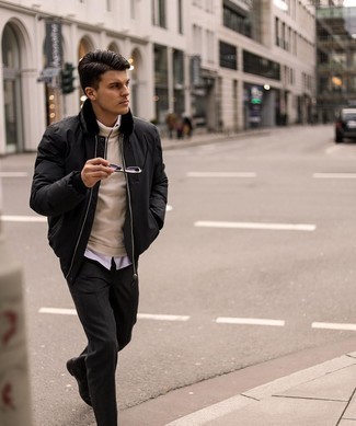 Black Bomber Jacket Chill Weather Outfits For Men: Pairing a black bomber jacket with charcoal chinos is a smart idea for a casually dapper ensemble. You could perhaps get a bit experimental on the shoe front and lift up this ensemble by sporting a pair of black leather chelsea boots.