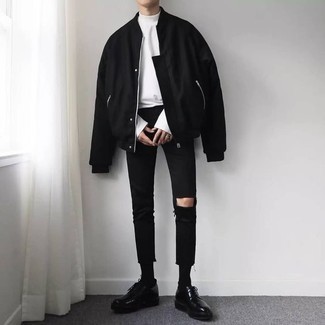 Black Ripped Skinny Jeans Outfits For Men: This combo of a black bomber jacket and black ripped skinny jeans is indisputable proof that a pared down casual outfit can still be really interesting. If you wish to easily dress up this outfit with shoes, why not complement this ensemble with a pair of black chunky leather derby shoes?