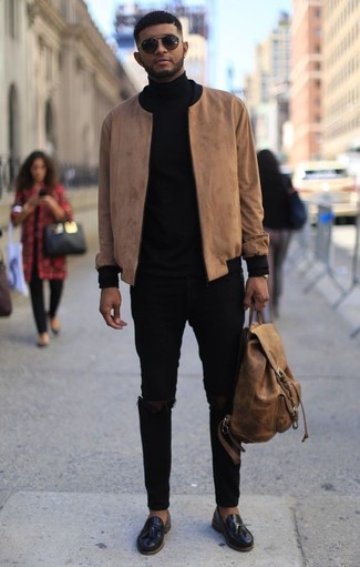 Black Ripped Skinny Jeans Outfits For Men: A tan bomber jacket and black ripped skinny jeans are a great ensemble that will easily carry you throughout the day and into the night. Introduce black leather tassel loafers to the equation for an instant style boost.