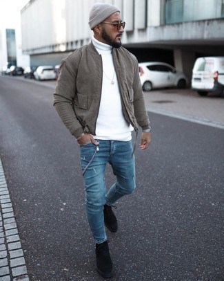 Blue Ripped Skinny Jeans Outfits For Men: An olive bomber jacket and blue ripped skinny jeans are a wonderful combo to integrate into your current casual collection. Finishing with black suede casual boots is an easy way to give an added dose of polish to your look.