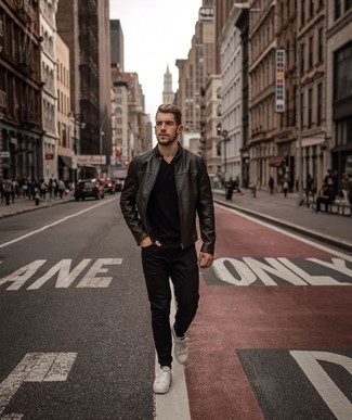 Dark Brown Leather Bomber Jacket Outfits For Men: A dark brown leather bomber jacket and black jeans are a great getup to have in your off-duty styling routine. If you're wondering how to round off, complement this ensemble with white canvas low top sneakers.