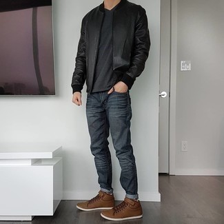 Charcoal V-neck T-shirt Outfits For Men: This pairing of a charcoal v-neck t-shirt and charcoal jeans is an excellent option for off duty. A pair of brown leather low top sneakers is a nice idea to finish this look.