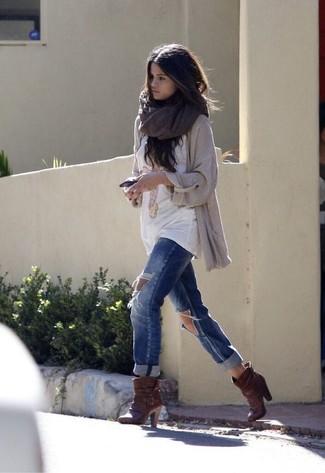 Selena Gomez wearing Dark Brown Leather Ankle Boots, Blue Ripped Boyfriend Jeans, White Print Crew-neck T-shirt, Beige Knit Open Cardigan