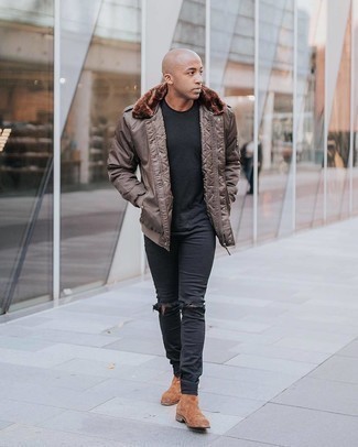 Brown Bomber Jacket Outfits For Men: Try pairing a brown bomber jacket with black ripped skinny jeans to feel completely confident and look dapper. Finishing off with a pair of brown suede chelsea boots is a surefire way to add a bit of flair to this getup.