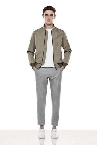 Brown Bomber Jacket with Grey Chinos Warm Weather Outfits: A brown bomber jacket and grey chinos teamed together are a nice match. Finishing with a pair of white canvas low top sneakers is a surefire way to introduce a playful touch to your ensemble.