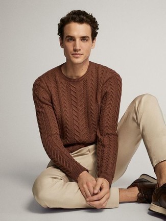Brown Cable Sweater Outfits For Men: For a winning off-duty option, you can never go wrong with this combination of a brown cable sweater and beige chinos. You can get a bit experimental in the shoe department and introduce a pair of dark brown athletic shoes to the equation.