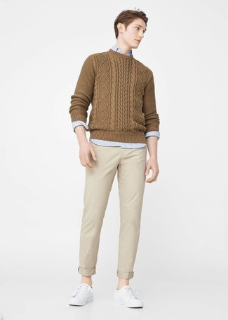 Tobacco Cable Sweater Outfits For Men: Such pieces as a tobacco cable sweater and beige chinos are an easy way to inject some cool into your day-to-day routine. Get a little creative with shoes and complete this look with a pair of white leather low top sneakers.