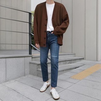 Brown Cardigan Outfits For Men: Who said you can't make a style statement with an edgy ensemble? Draw the attention in a brown cardigan and blue ripped jeans. Introduce a pair of white leather low top sneakers to the mix et voila, your ensemble is complete.