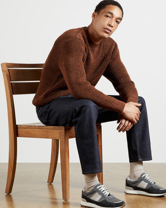 Grey Athletic Shoes Outfits For Men: This laid-back combo of a brown crew-neck sweater and navy jeans is extremely easy to throw together without a second thought, helping you look amazing and ready for anything without spending too much time going through your closet. Add a more relaxed finish to by rocking grey athletic shoes.