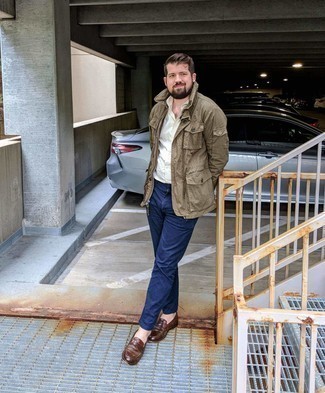 Dark Brown Field Jacket Outfits: For something more on the casually edgy side, pair a dark brown field jacket with navy chinos. Don't know how to complement this look? Wear brown leather loafers to dial it up.