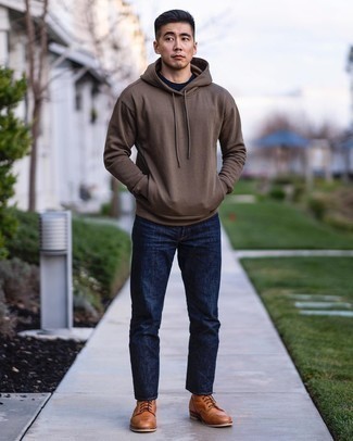 Tobacco Boots Outfits For Men: This combination of a brown hoodie and navy jeans is a safe go-to for an effortlessly dapper look. Wondering how to complete your look? Finish off with a pair of tobacco boots to step up the wow factor.