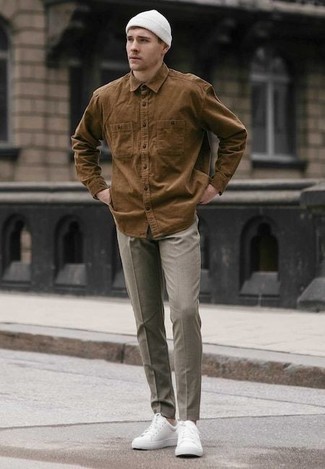 Dark Brown Long Sleeve Shirt Outfits For Men: Showcase your credentials in menswear styling by opting for this relaxed casual combination of a dark brown long sleeve shirt and grey chinos. A trendy pair of white canvas low top sneakers is a simple way to add a little kick to the outfit.