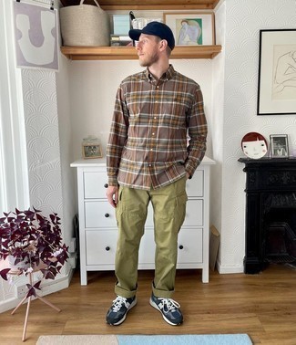 Brown Plaid Long Sleeve Shirt Outfits For Men: Consider pairing a brown plaid long sleeve shirt with olive cargo pants to feel 100% confident and look casual and cool. On the fence about how to finish? Complete your outfit with navy and white athletic shoes to change things up a bit.