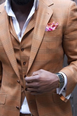 This is definitive proof that a brown plaid three piece suit and a white dress shirt look amazing when worn together in a sophisticated look for a modern dandy.
