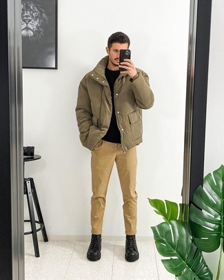 Work Boots Outfits For Men: This combination of a brown puffer jacket and khaki chinos is extra versatile and creates instant appeal. Finishing off with a pair of work boots is a surefire way to introduce a more casual touch to this getup.