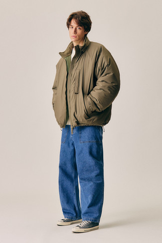 500+ Chill Weather Outfits For Men: This combo of a brown puffer jacket and blue jeans couldn't possibly come across as anything other than devastatingly stylish and effortlessly sophisticated. Round off with a pair of charcoal canvas low top sneakers to add a little kick to the look.