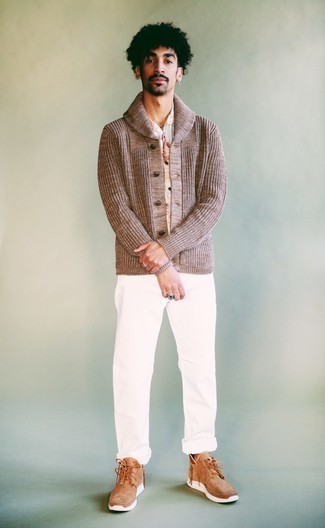 Tan Suede Desert Boots Outfits: This combination of a brown shawl cardigan and white chinos embodies rugged sophistication and effortless style. If not sure about the footwear, complete your outfit with a pair of tan suede desert boots.