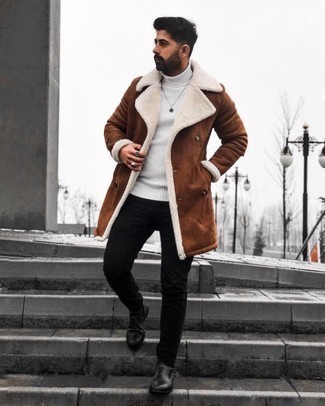 Brown Shearling Coat Outfits For Men: This off-duty combo of a brown shearling coat and black skinny jeans is very easy to throw together in seconds time, helping you look dapper and ready for anything without spending a ton of time digging through your closet. A pair of black leather chelsea boots instantly dials up the fashion factor of any ensemble.