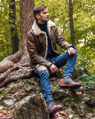Blue Ripped Jeans Outfits For Men: Opt for a brown shearling jacket and blue ripped jeans to achieve an interesting and edgy ensemble. Not sure how to round off your outfit? Round off with brown leather casual boots to up the fashion factor.