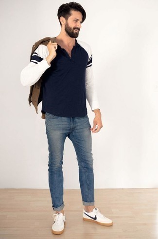 Brown Shirt Jacket Outfits For Men: A brown shirt jacket and blue jeans are a nice combination to have in your daily fashion mix. A pair of white and navy leather low top sneakers effortlessly turns up the cool of your outfit.