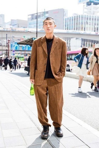 Brown Suit Outfits: A brown suit and a black crew-neck t-shirt are fitting for both smart casual settings and day-to-day wear. Let your sartorial chops truly shine by rounding off this outfit with dark brown athletic shoes.