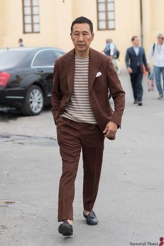 Dark Brown Crew-neck T-shirt Outfits For Men: Ramp up your menswear game by marrying a dark brown crew-neck t-shirt and a brown suit. A pair of black leather tassel loafers easily turns up the style factor of any getup.