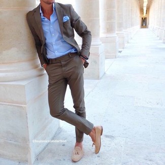 One of the best ways to style out such a timeless menswear item as a brown suit is to pair it with a light blue long sleeve shirt. If in doubt about the footwear, stick to beige suede tassel loafers.