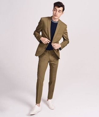 Dark Brown Suit Outfits: This combo of a dark brown suit and a navy crew-neck t-shirt is hard proof that a simple ensemble can still be really interesting. A pair of white canvas low top sneakers will bring a mellow vibe to this outfit.