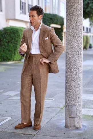 Brown Suit Outfits: Loving how this combo of a brown suit and a white dress shirt instantly makes a man look stylish and polished. Why not rock a pair of brown suede tassel loafers for a dressed-down touch?